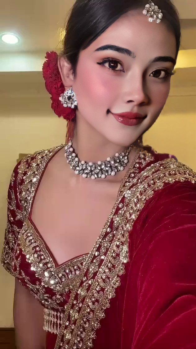 The red sari is absolutely beautiful image