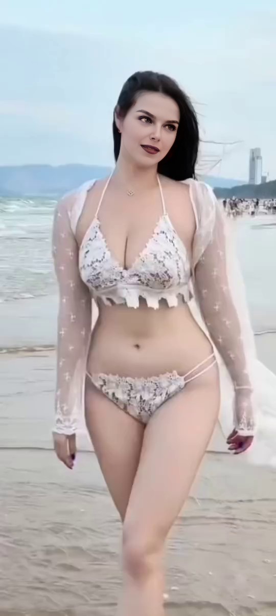 Bikini Beauty Walking on the Beach image