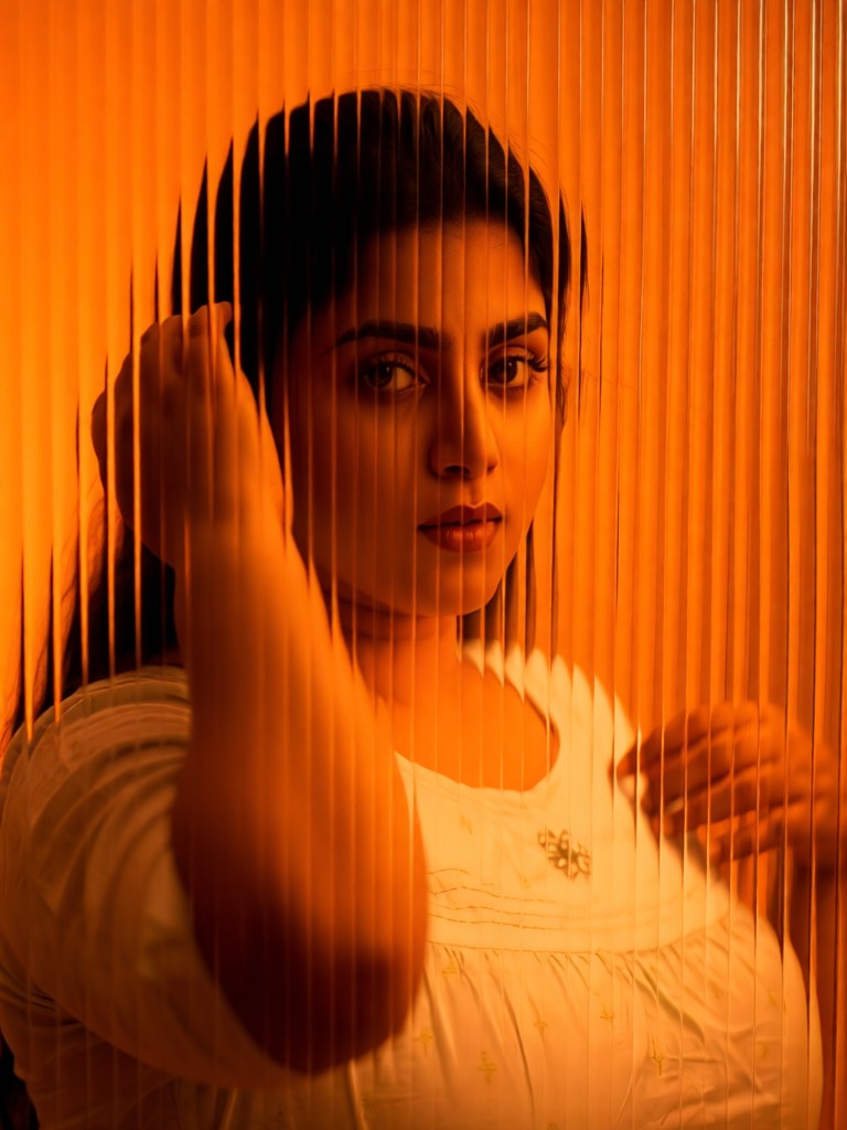 Portrait through vertical ribbed glass image
