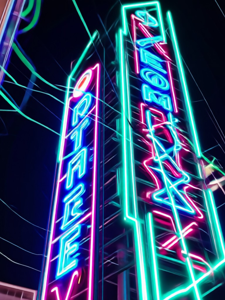 Musician with purple neon glow stage effect