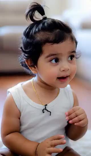 baby making funny dance faces image